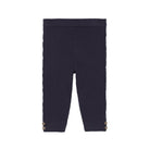 Navy ribbed leggings with gold buttons on a white background