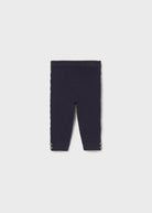 Navy blue leggings on a light gray background