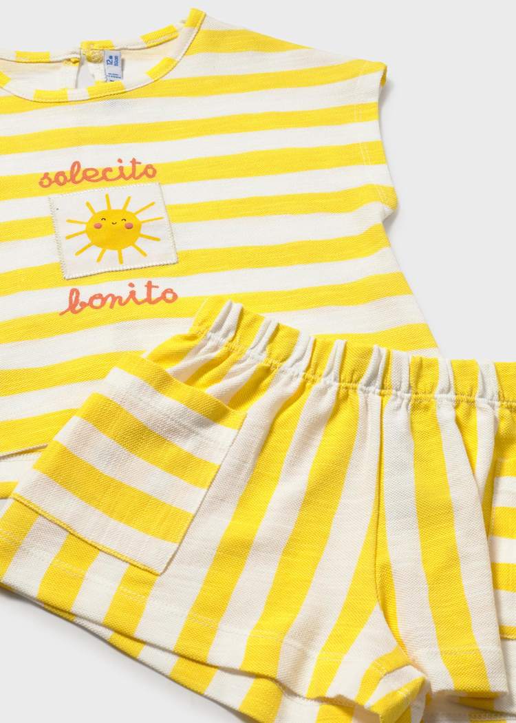 Yellow and white striped outfit with a sun design on a white background