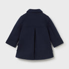 Navy blue coat on a light gray background