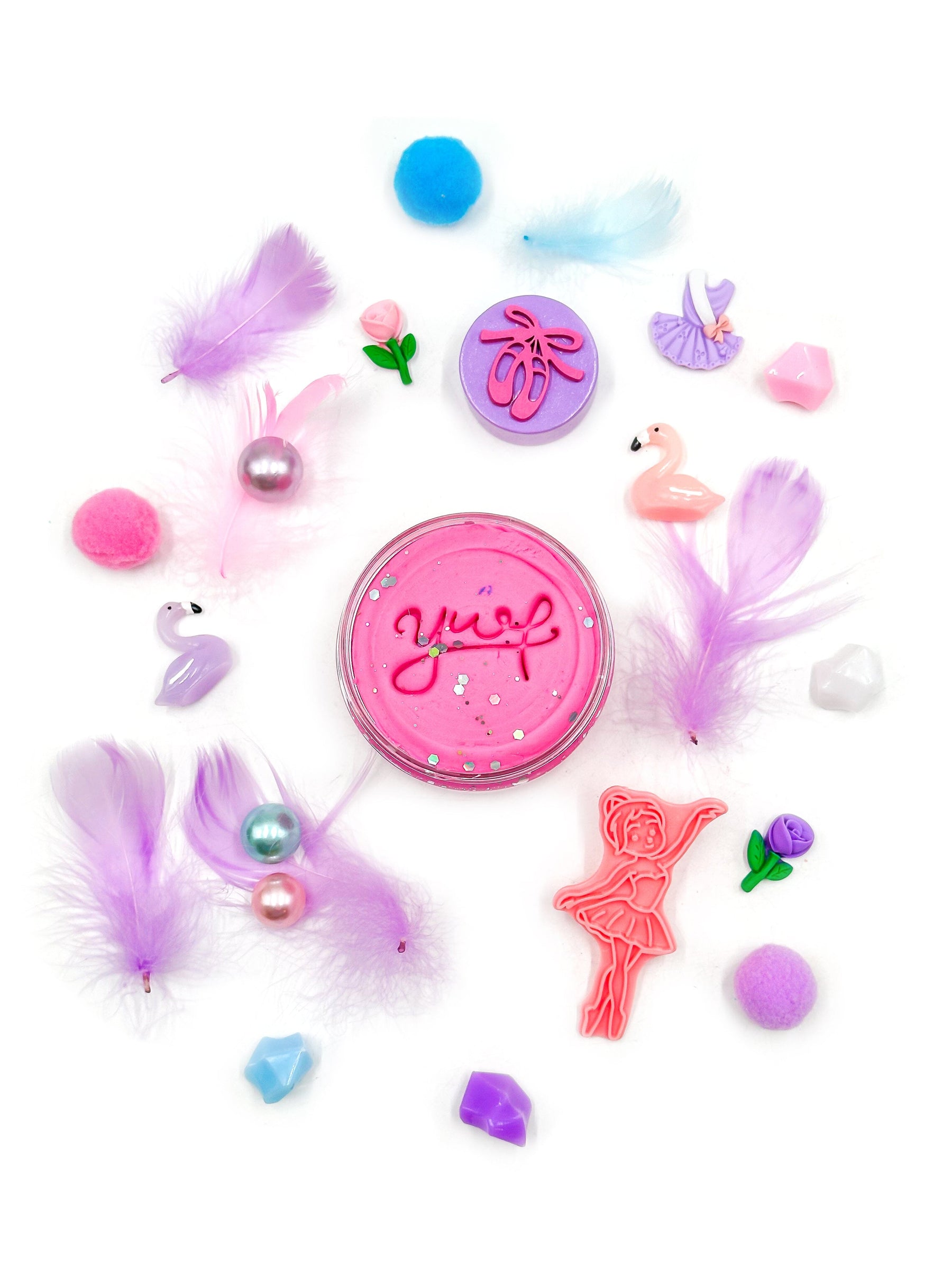 Colorful cat toys with 'Yup' branding on a white background