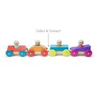 Colorful wooden toy train with four cars on a white background