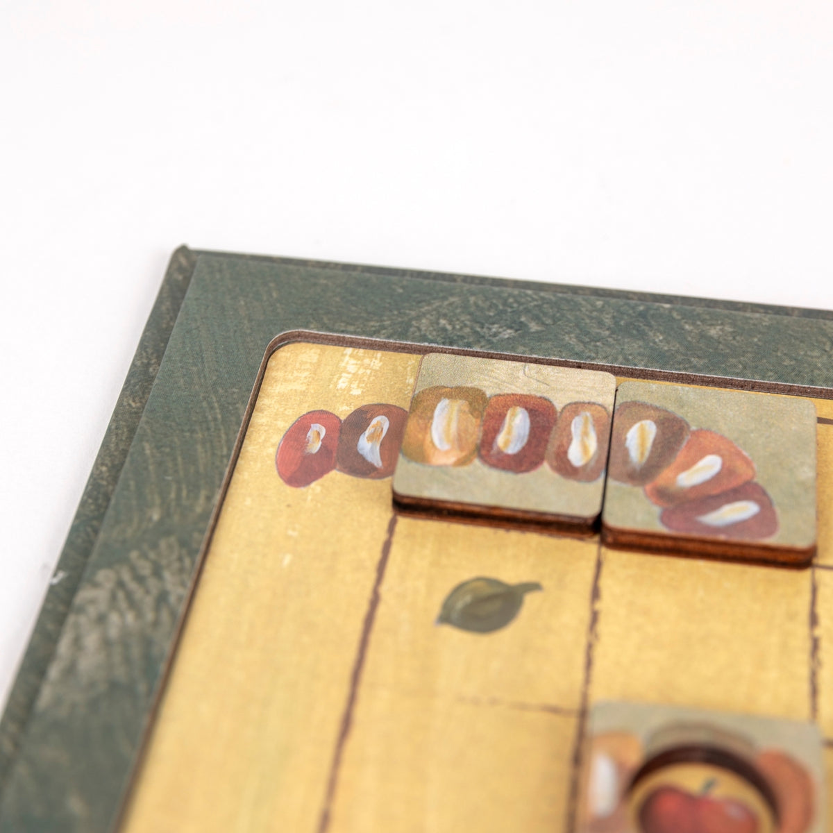 Close-up of a vintage book with wooden stamps on a white background