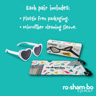 Heart-shaped sunglasses with packaging and cleaning sleeve on a teal background, featuring ro-sham-bo eyewear branding.