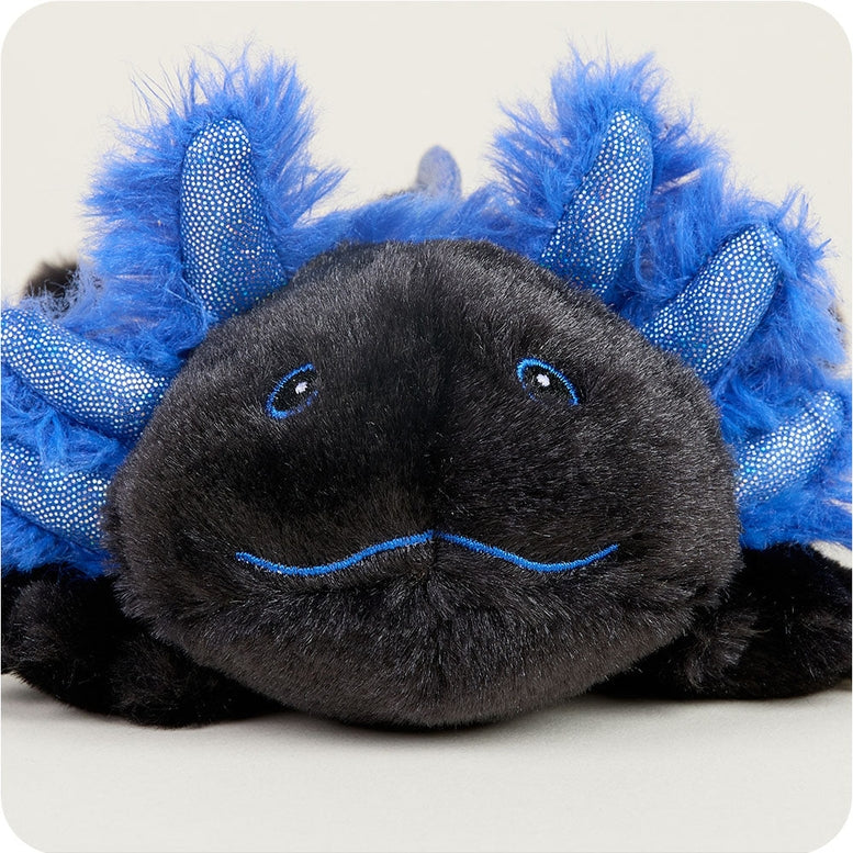 A black and blue Axolotl Junior plush toy by Warmies, featuring soft black fur and vibrant blue feathery external gills, smiling gently.