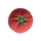 Red tomato-shaped toy with green stem on a white background