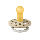 Yellow and beige pacifier on a blue background