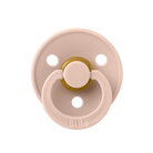 Pink pacifier with gold center on a white background