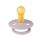 Yellow and pink pacifier on a dark green background