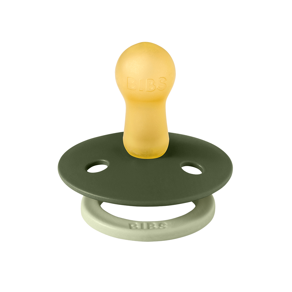 Green and yellow pacifier with 'BIBS' branding on a white background