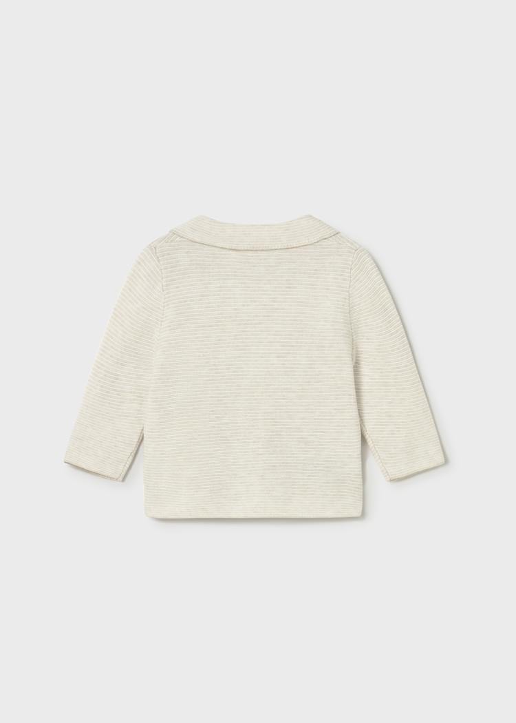 Light-colored sweater on a white background