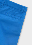 Close-up of blue pants on a white background