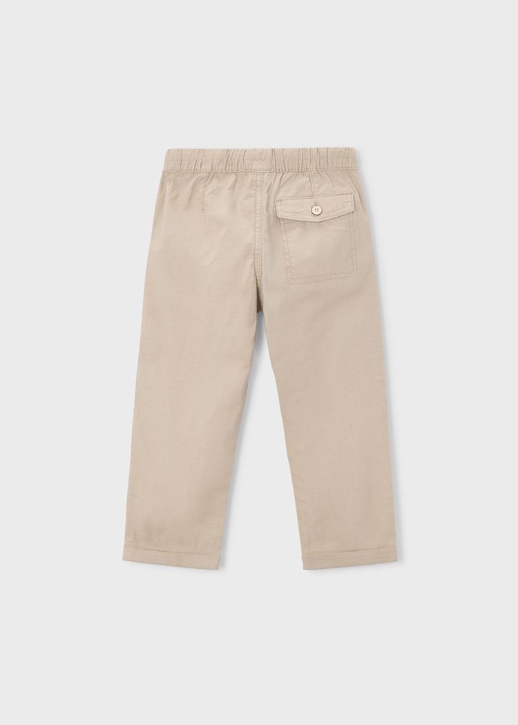 Beige pants on a light gray background