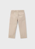 Beige pants on a light gray background