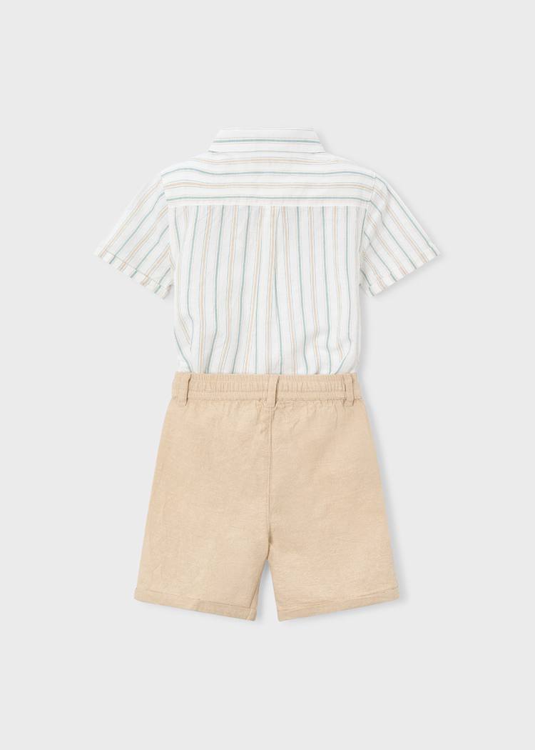 Striped shirt and beige shorts on a light gray background