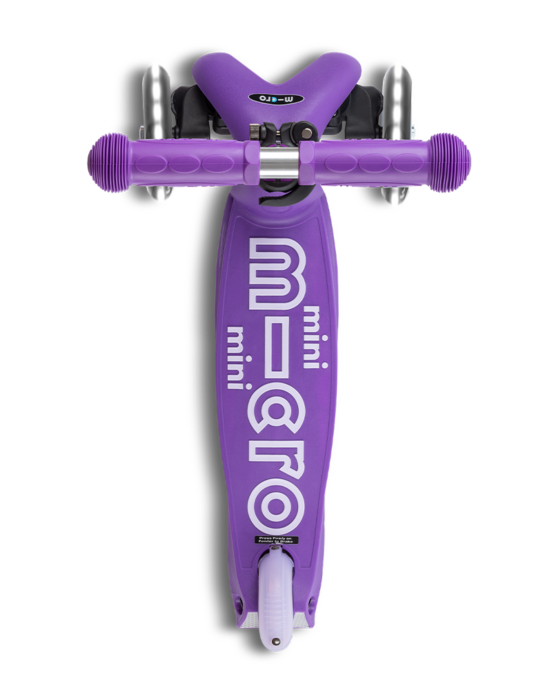 Purple scooter with 'micro' branding on a white background