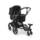 Black stroller with a tray on a white background