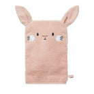 Pink towel with bunny face and ears on a white background