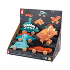 Display of dinosaur toys in a packaging box with cartoon illustrations on a white background