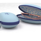 Light blue hair tie case with floral design on a white background