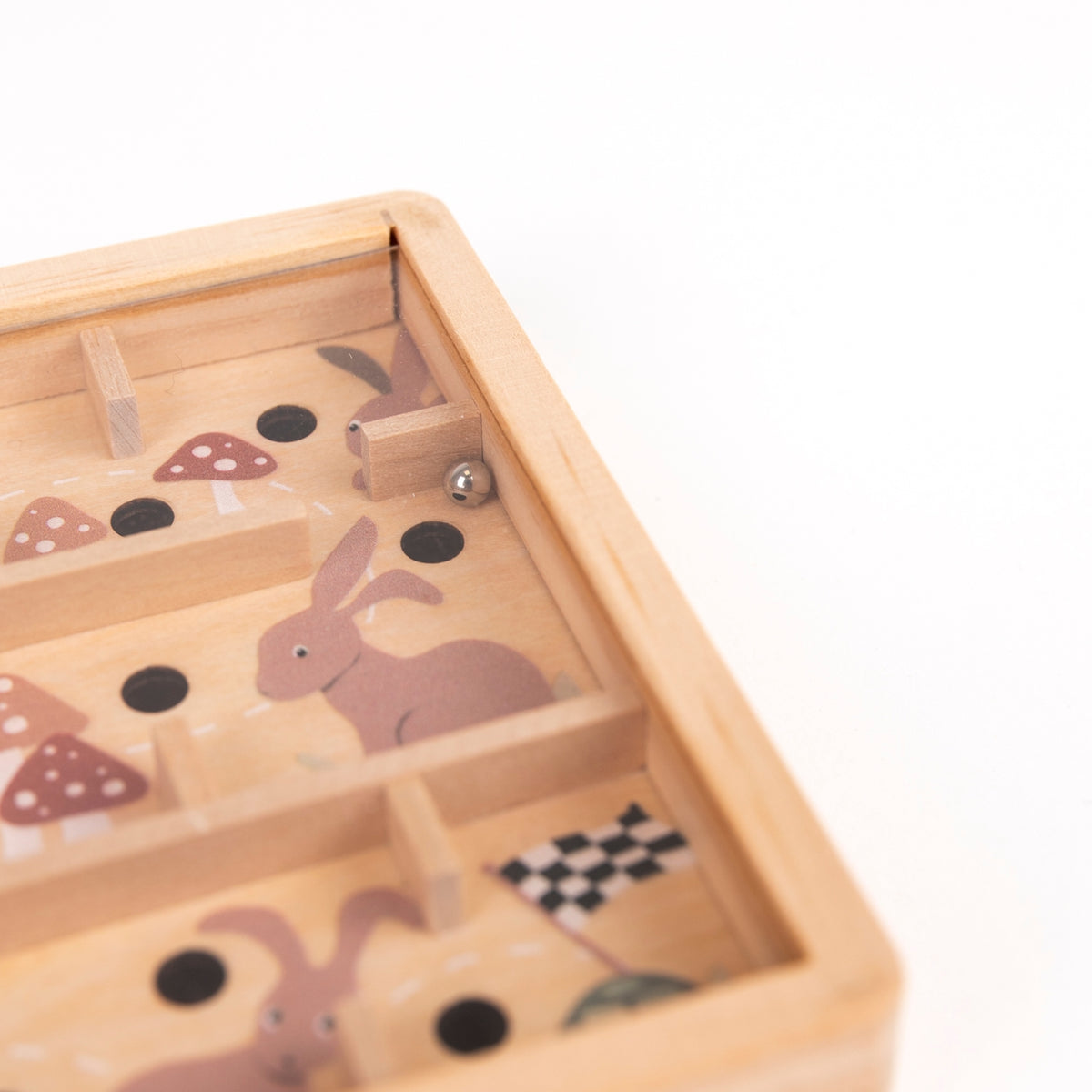 Wooden toy with rabbit and mushroom designs on a white background