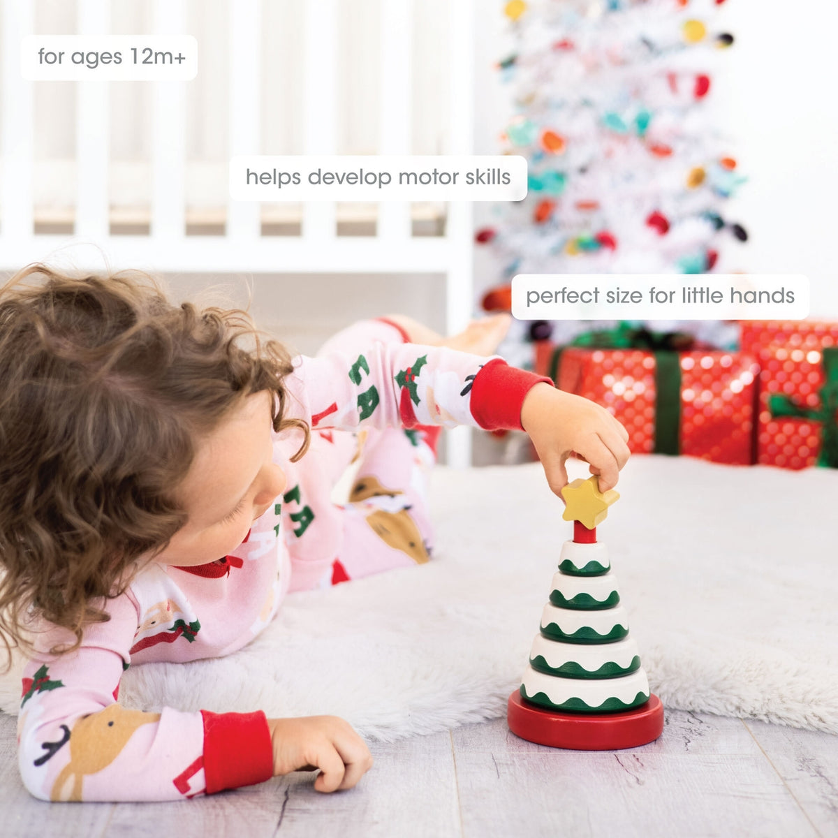 Child playing with a Christmas-themed toy in a festive setting
