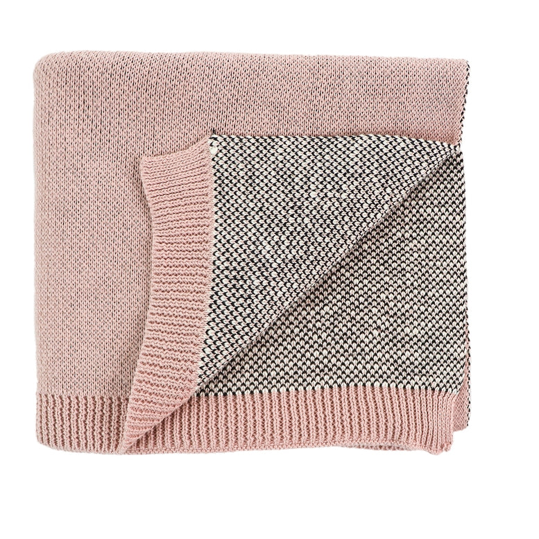 A folded knit blanket with a dusty pink ribbed border and a heathered gray and white woven center, shown on a plain white background.