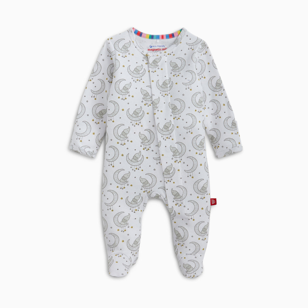 A baby footed sleeper in white with a repeating gray crescent moon and star pattern, featuring a colorful striped inner collar and a small red tag near the ankle.