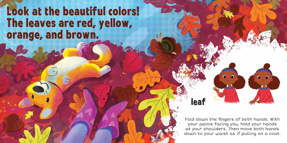 An open board book page from "Sign The Seasons: Fall" showing text that reads "Look at the beautiful colors! The leaves are red, yellow, orange, and brown." above an illustration of a joyful dog playing amidst a pile of colorful autumn leaves. On the right page, text labels "leaf" above an inset illustration of a child demonstrating the American Sign Language sign for "leaf," accompanied by instructional text detailing the hand movement.