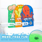 Three colorful packages of bubble bath with cartoon characters on a tiled bathroom background.