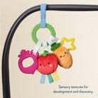 Colorful baby toy with fruits and vegetables on a beige background