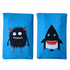 Two blue bean bags with a black monster and shark design on a white background