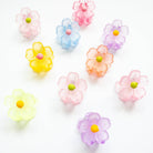 Colorful flower-shaped candies on a white background
