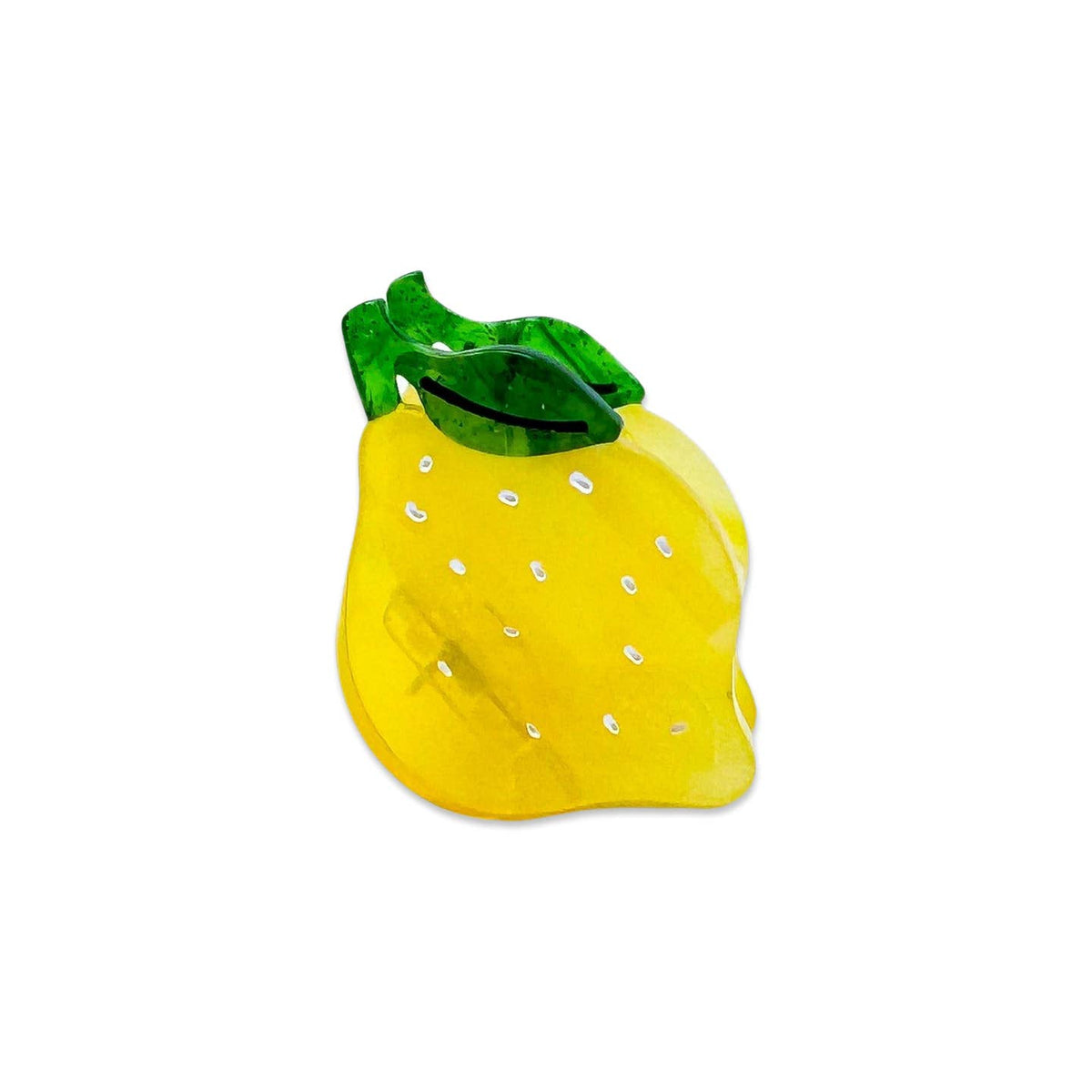 Yellow glass pineapple with green leaves on a white background