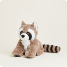 A studio product photo of a plush Raccoon by Warmies sitting upright against a plain background, featuring brown and white fur, distinctive black eye patches, and a striped tail.