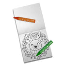 A small white coloring book or notepad on a white background, featuring a black-and-white reindeer face inside a wreath design on the lower page. Two crayons are placed on top: one orange with white stars and the word 'coly' near the tip, and one green with white stars and the same 'coly' branding.