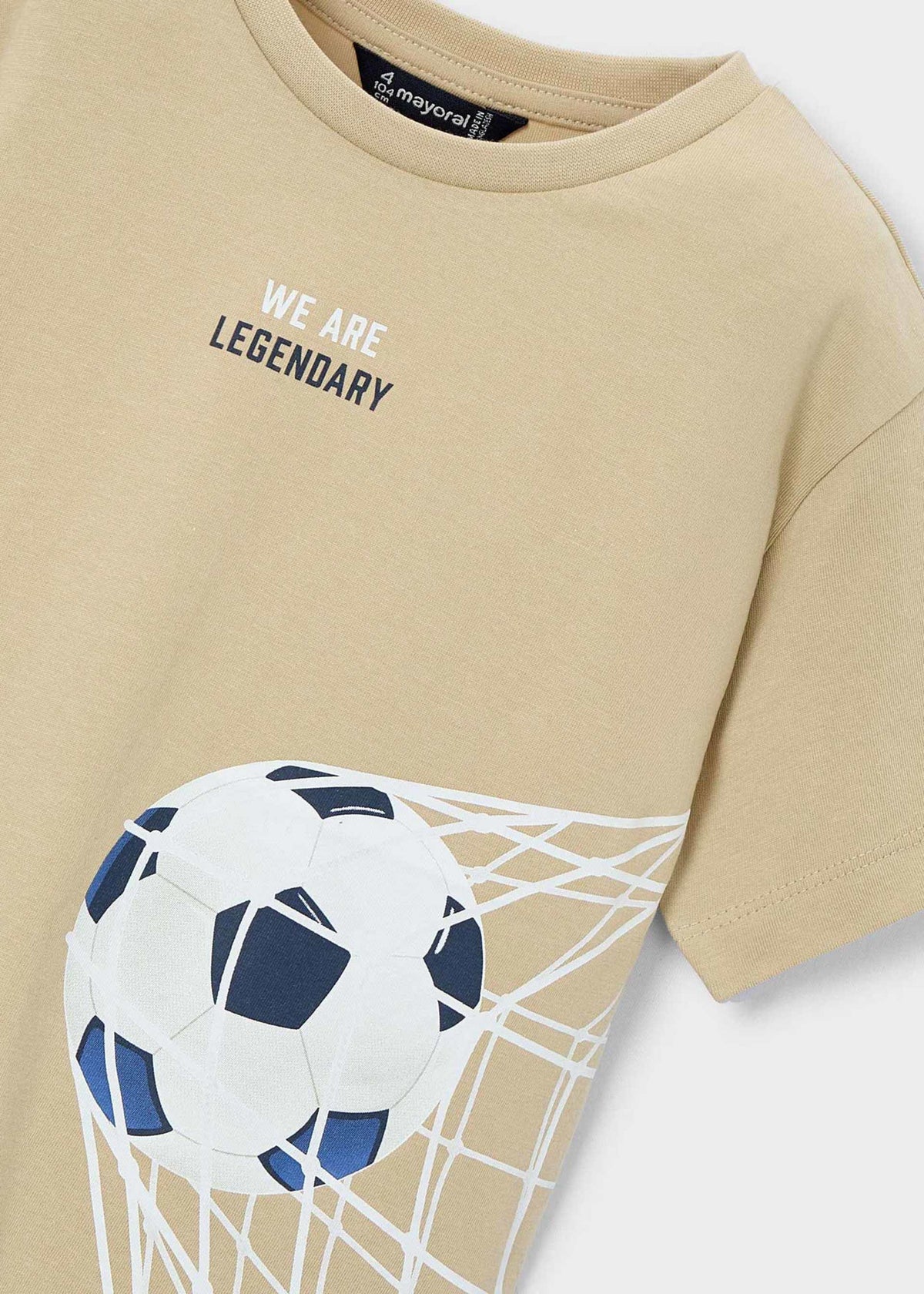 Beige t-shirt with soccer ball and net graphic and 'We Are Legendary' text.