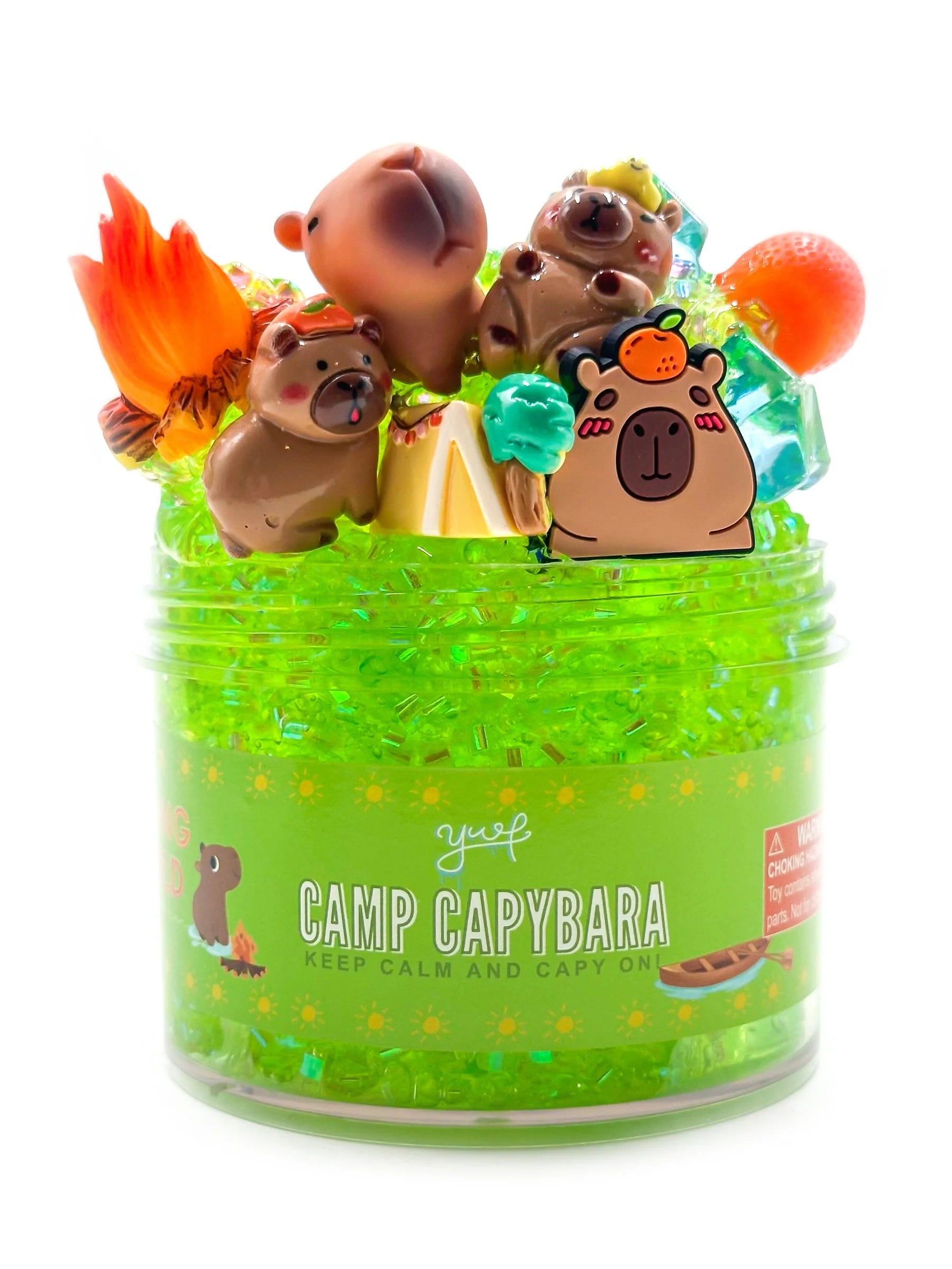 Jar of 'Camp Capybara' with capybara-themed toys on a white background