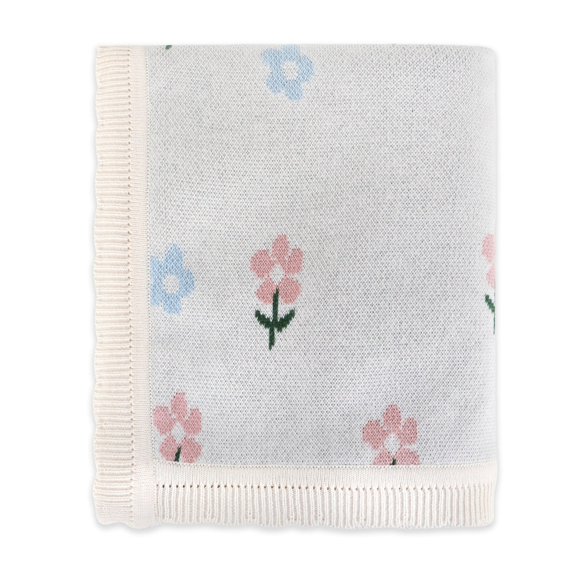 A folded white knit blanket with pink and blue embroidered flowers and green stems, featuring cream-colored ribbed borders on all sides.