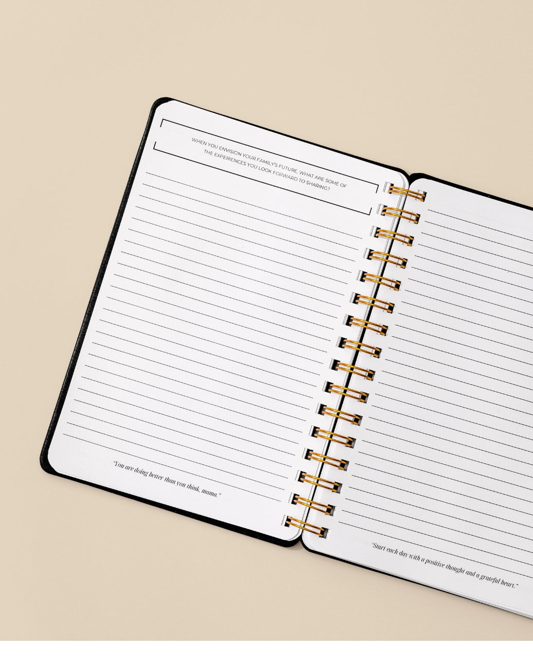 Open spiral-bound planner with lined pages on a beige background