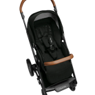 A profile view of a black MIXX Next + Pipa Aire RX Travel System by Nuna stroller featuring brown leatherette handlebar and armbar accents, shown against a checkered transparent background.
