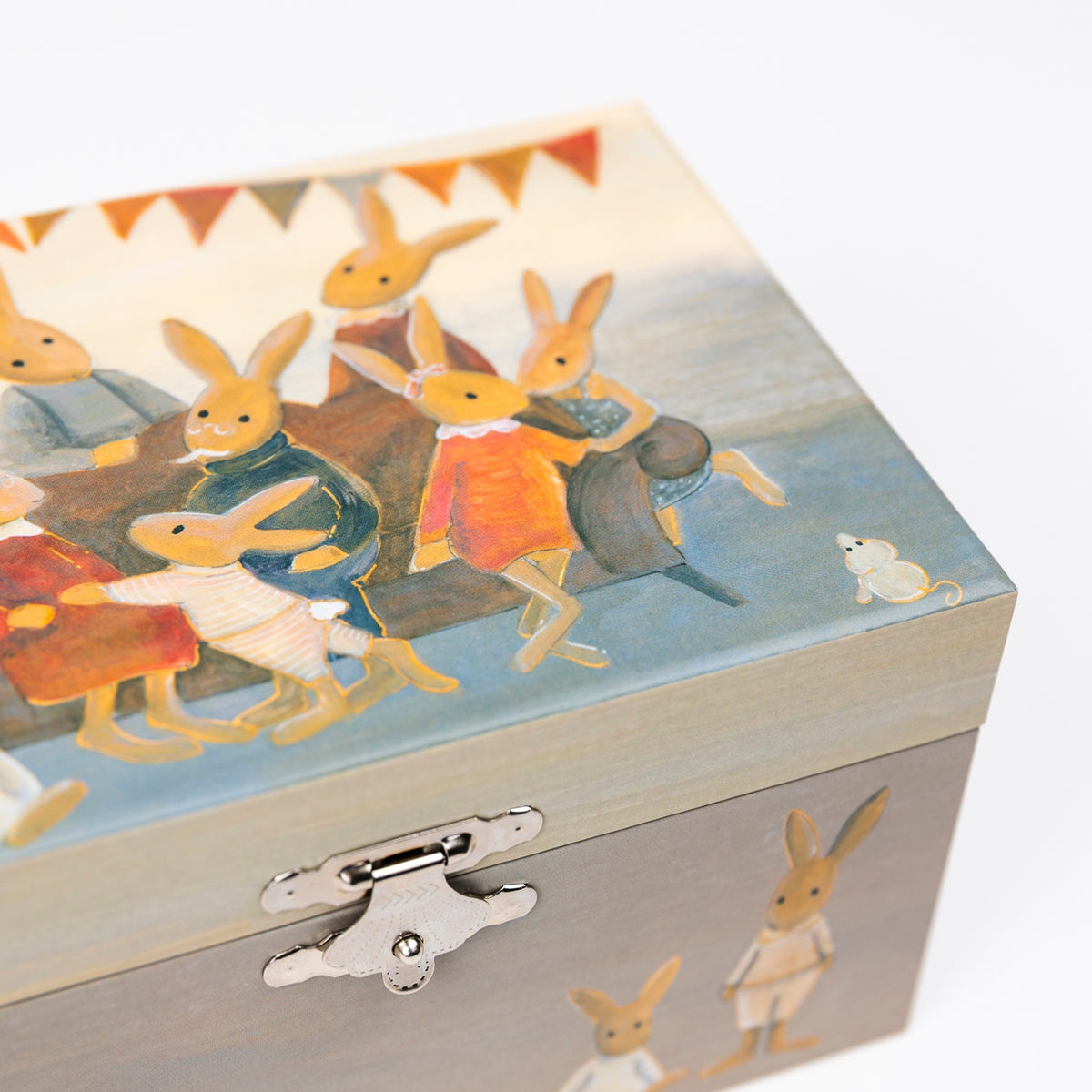 A decorative wooden box with a silver metal clasp, featuring an illustrated scene of rabbits in colorful clothing on the lid and additional rabbit figures on the front, photographed against a plain white background.