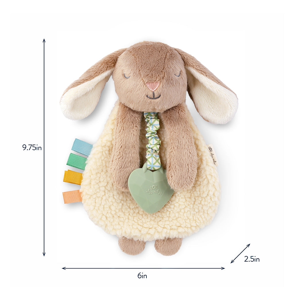 Plush bunny toy with rattle and measurements on a white background