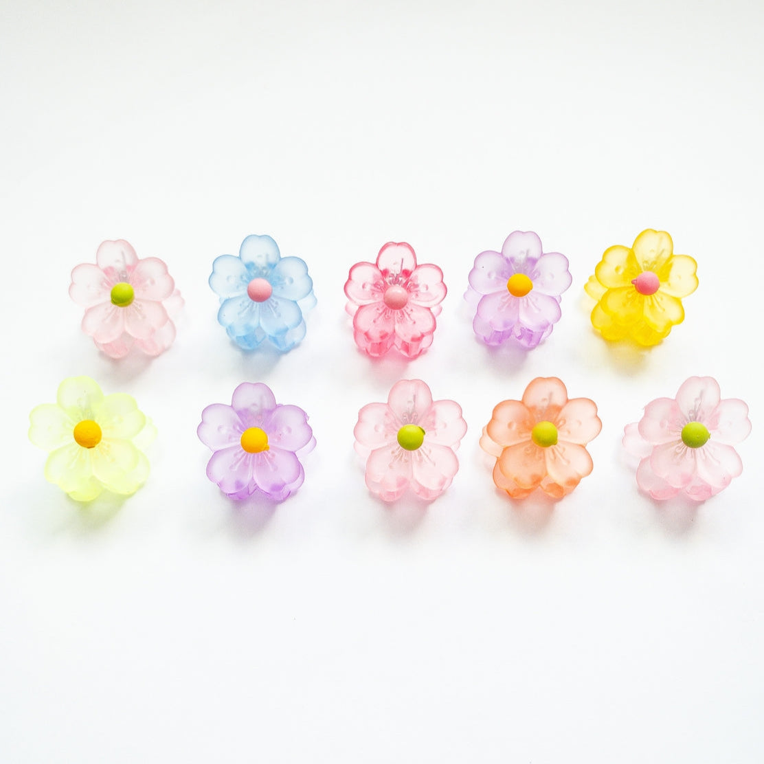 Colorful flower-shaped candies on a white background