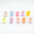 Colorful flower-shaped candies on a white background