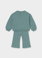 A two-piece children's loungewear set in a dusty sage green color, featuring a long-sleeve sweatshirt and matching wide-leg pants, shown from the back on a light gray background.