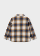 A long-sleeve plaid button-up shirt shown from the back, featuring a pattern of navy blue, tan, and cream on a light gray background.