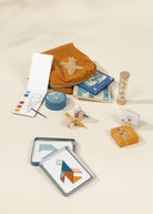 Collection of children's toys and educational items on a beige surface