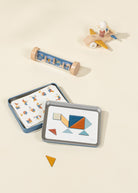 Set of geometric shape cards with a wooden airplane and cylindrical toy on a beige background