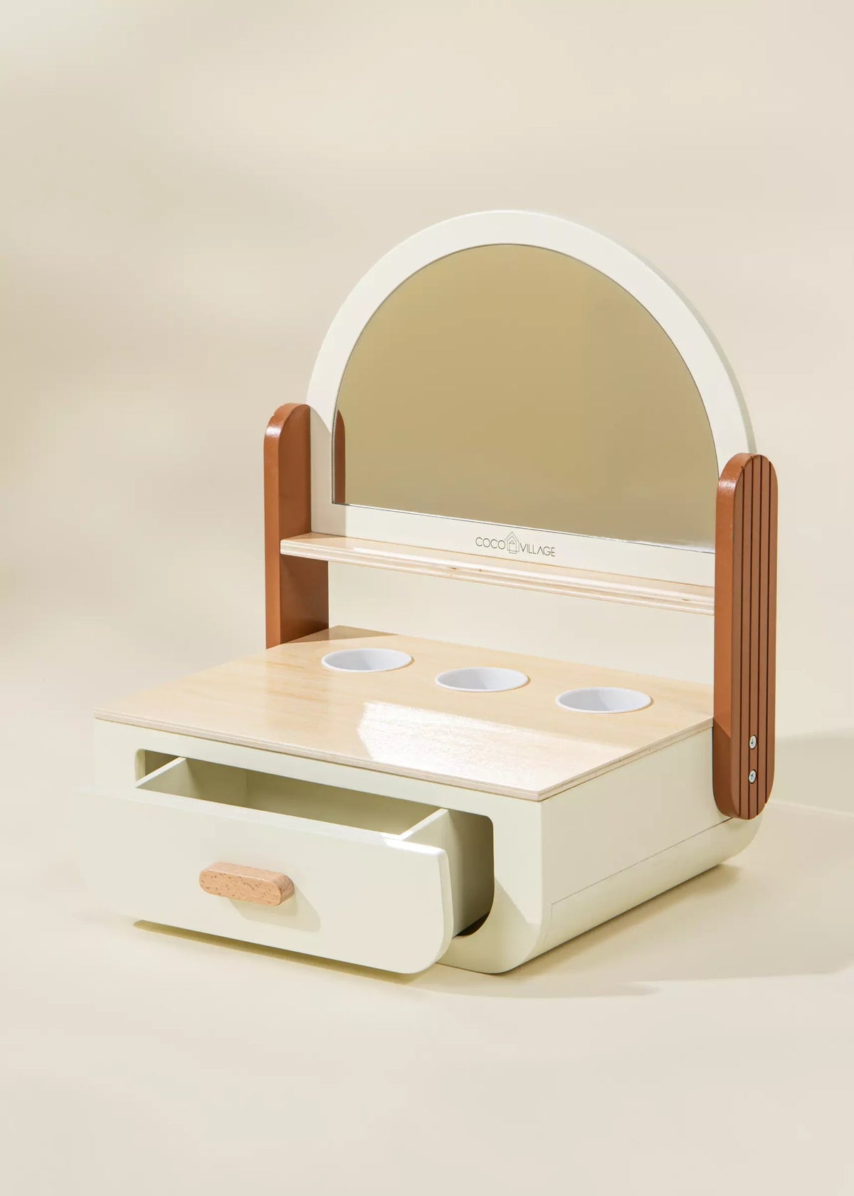 Children's vanity with mirror, drawers, and sink on a beige background